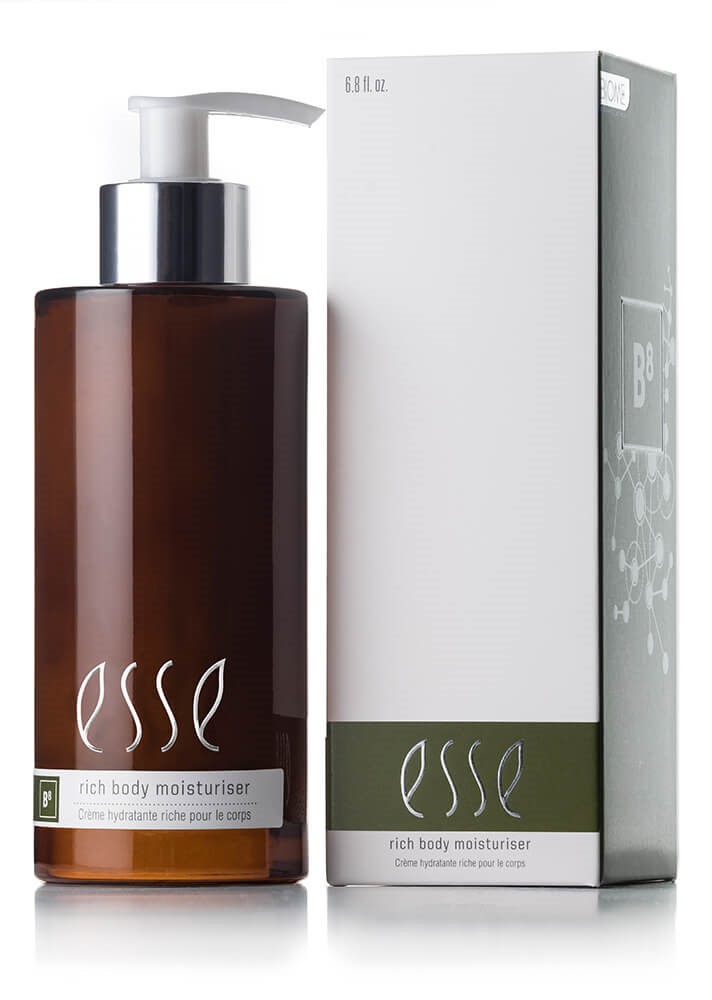 A 200ml bottle of Esse Rich Body Moisturiser displayed alongside its packaging. The amber bottle features a white pump dispenser and is labeled "esse B8." The white box has green accents and text that corresponds with the label on the bottle.